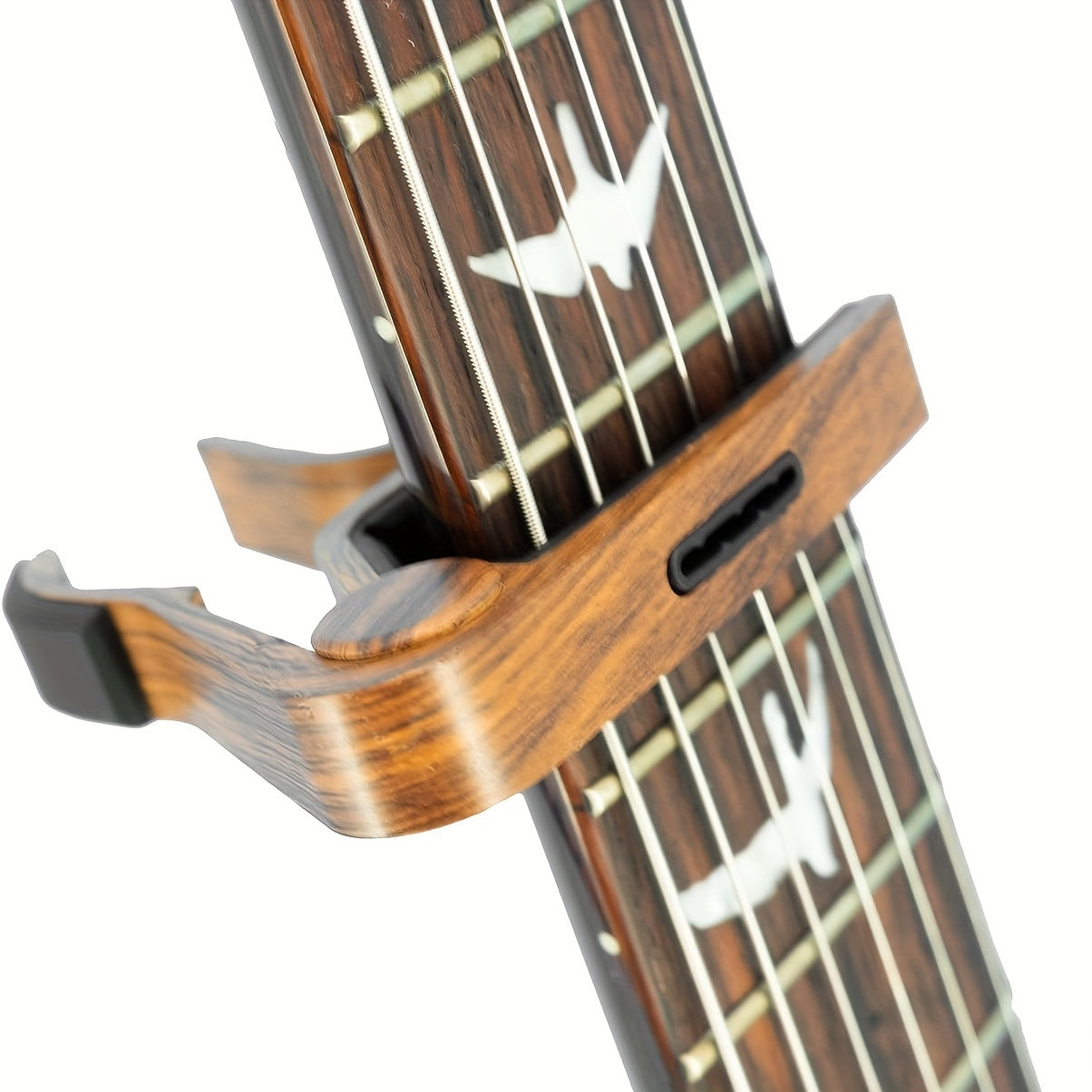 Rosewood guitar capo with pick holder, ideal for a variety of instruments. Comes with picks.