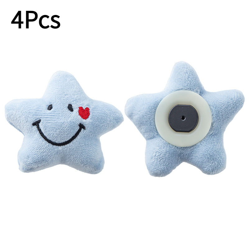 Set of 4 adorable star-shaped quilt and bed skirt fixators made of practical nylon. These anti-run corner holders feature smiling faces and hearts in blue, ensuring secure bedding with their soft plush design.