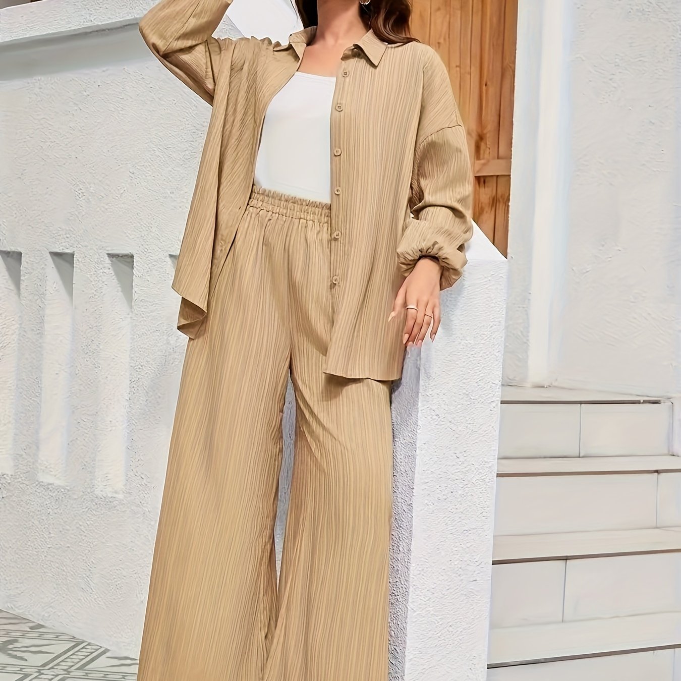 Women's two-piece polyester suit set with reversible collar, perfect for a stylish vacation look.