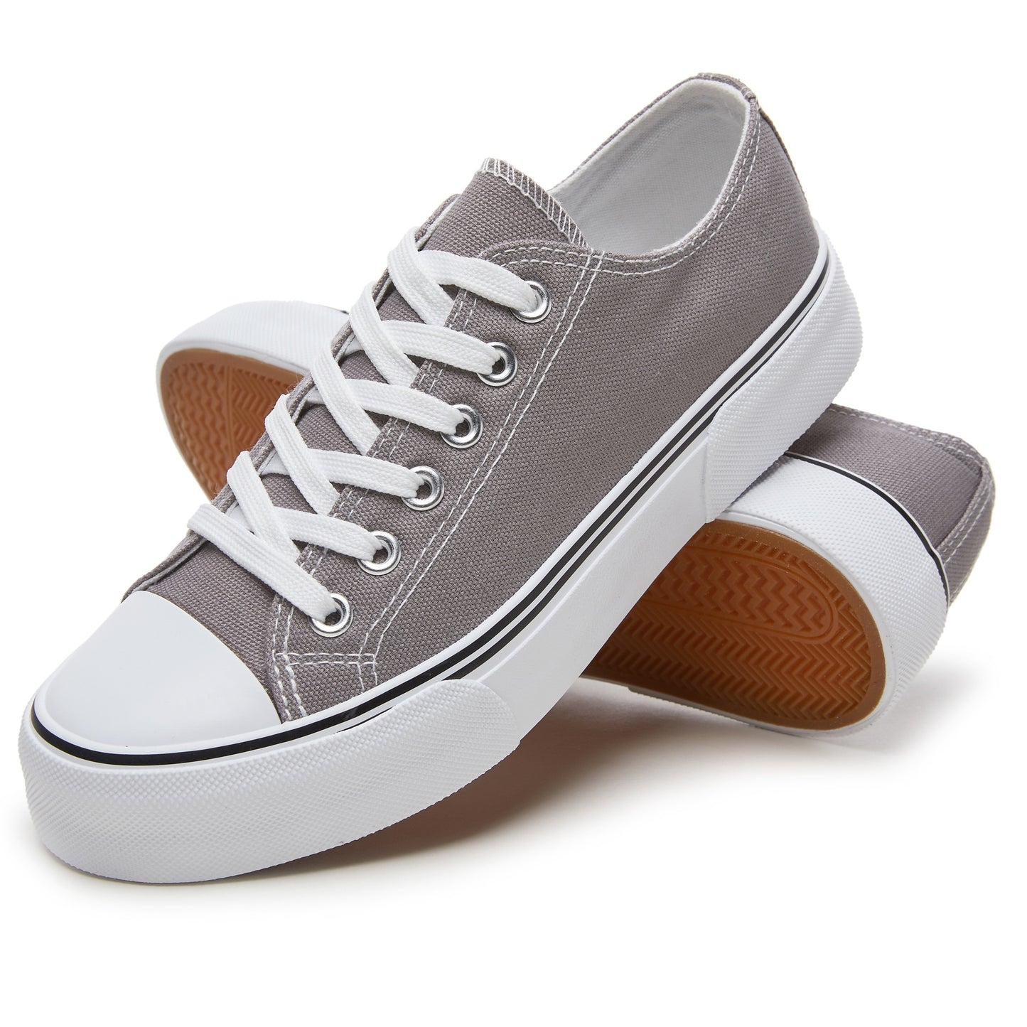 Women's casual canvas sneakers in solid color with plain toe, rubber lace-up design, machine washable fabric, and lightweight rubber sole. Suitable for all seasons.