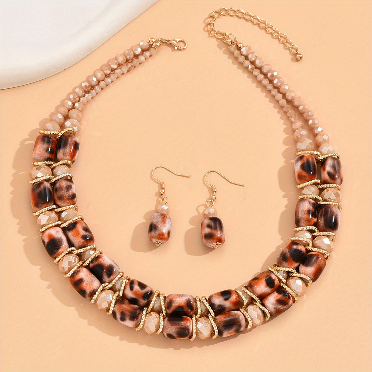 Complete your look with this Bohemian-style women's jewelry set featuring a 2-strand beaded necklace and earrings, suitable for everyday wear or special events.