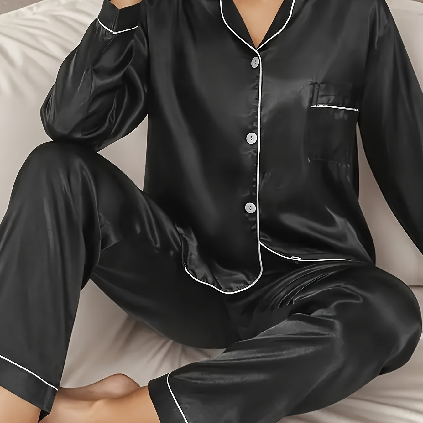 Solid satin lounge set with long sleeve button-up top and elastic pants for women's loungewear.