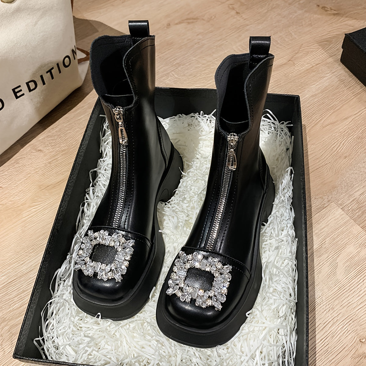 Ankle boots with square toe, rhinestone accents, thick sole, zipper closure, rubber sole, high heel, all-season comfort.