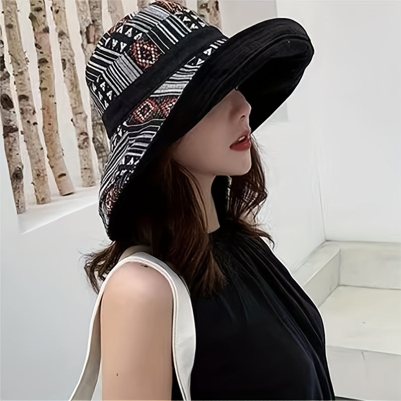 Reversible wide brim cotton bucket hat for women in dark blue with geometric pattern and multicolor accents. Great for travel and outdoor activities. Provides UV protection and