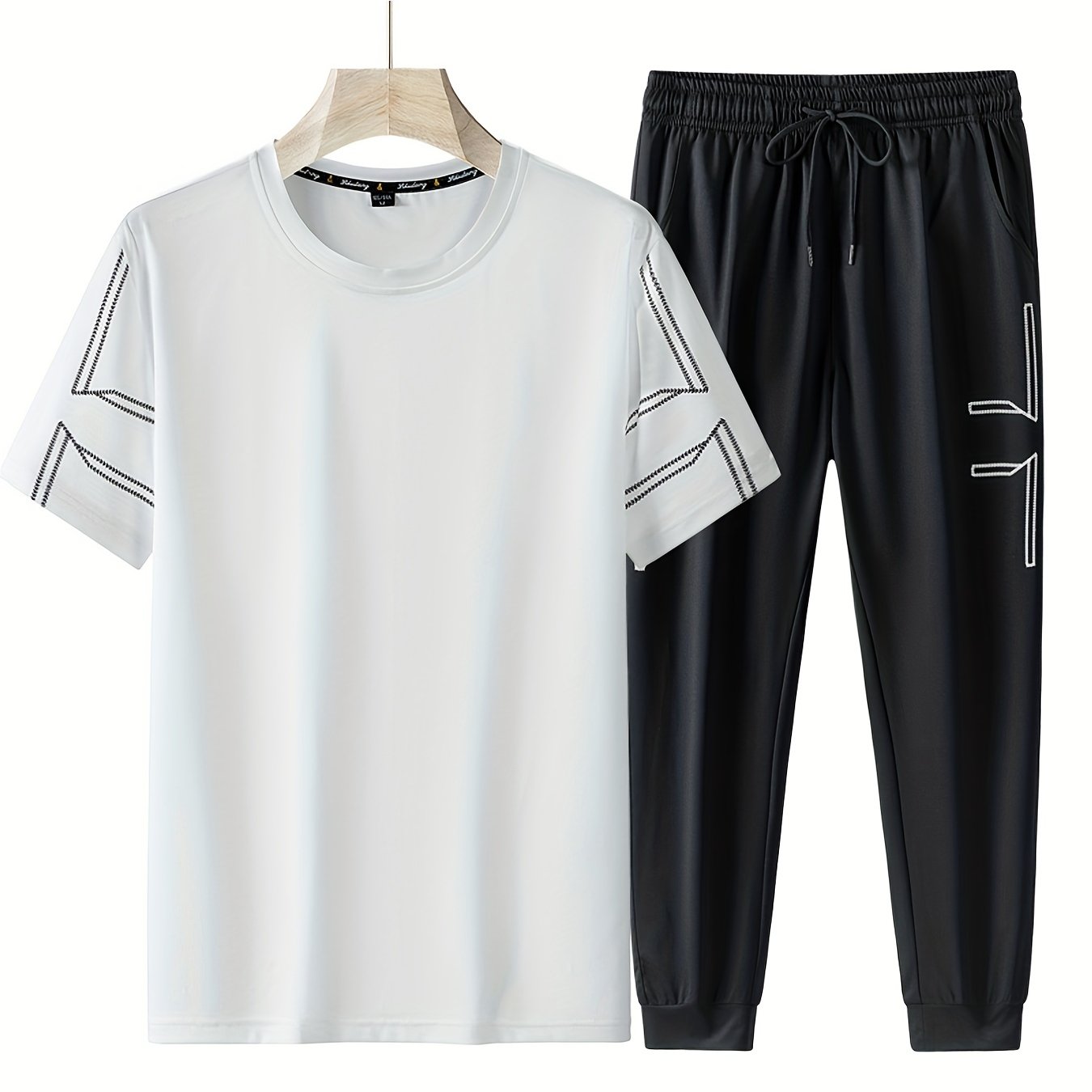 Men's 2 piece outfits with geometric line pattern t-shirt and drawstring jogger pants.