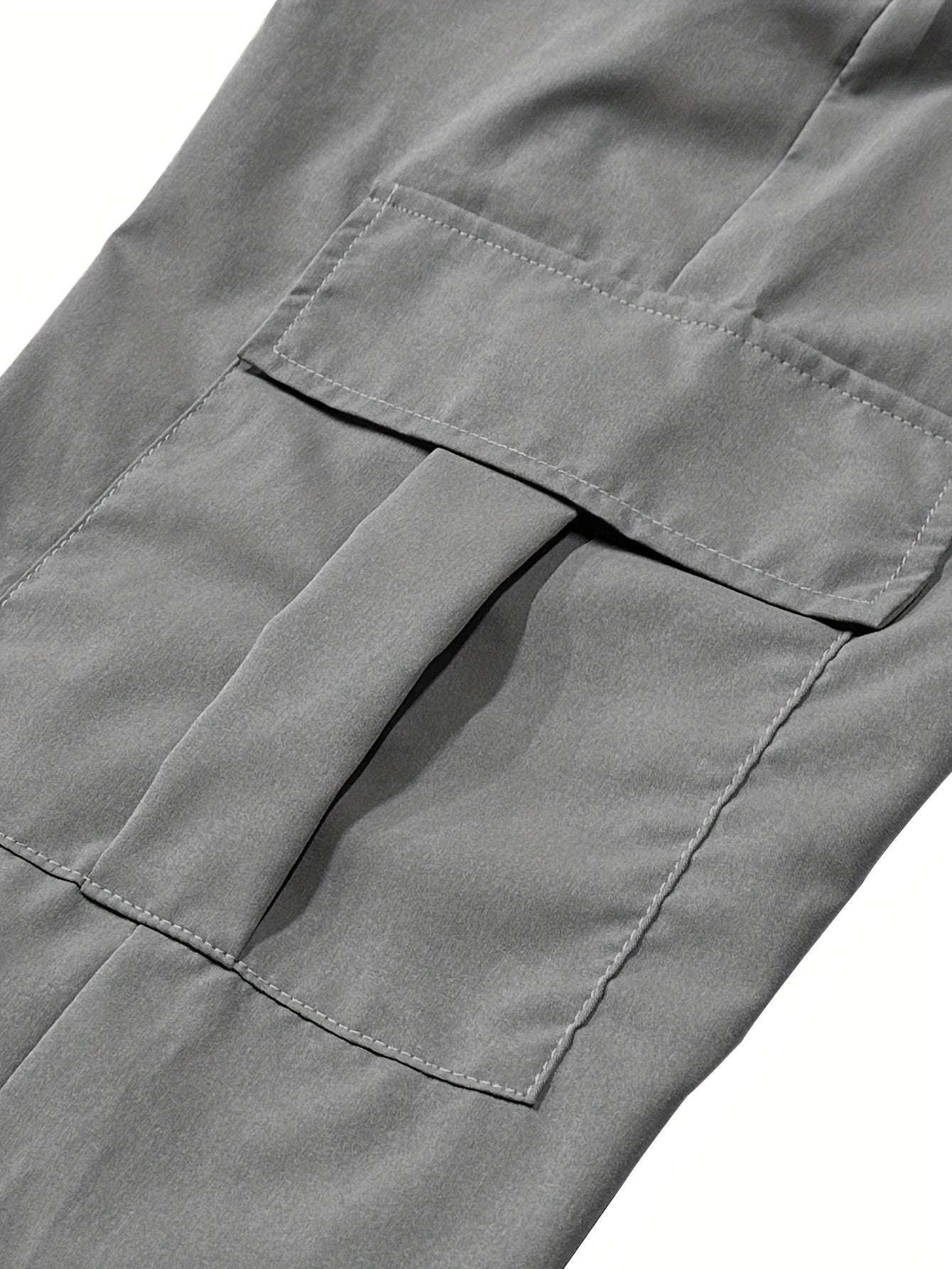 Men's comfortable polyester cargo pants in solid colors with side pockets - perfect for summer outdoor activities.