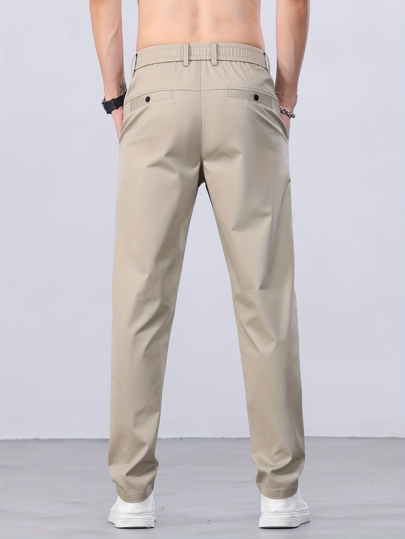 1 Men's all-season casual pants in caramel color, made of cotton blend with slight stretch and regular fit, featuring mid waist, pockets, zipper fly, and woven work style for weekend casual.