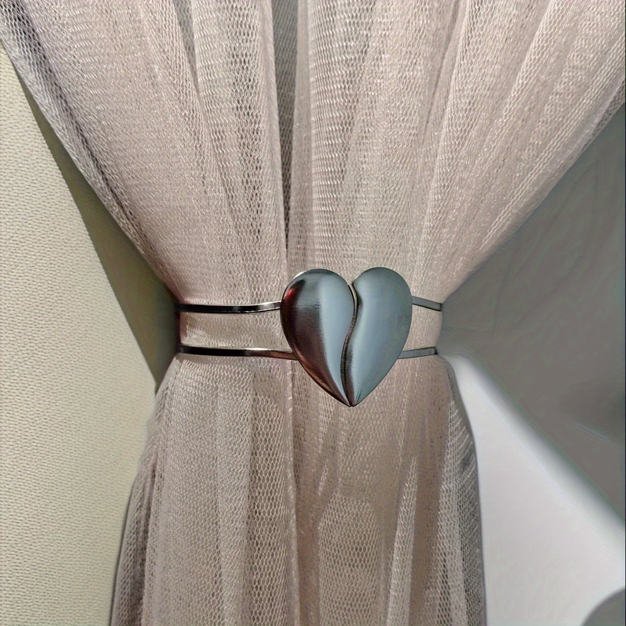 Heart-shaped decor curtain holder made of alloy, featuring a minimalist hollow design. Perfect for use in living rooms, offices, or homes as a stylish and functional curtain accessory.