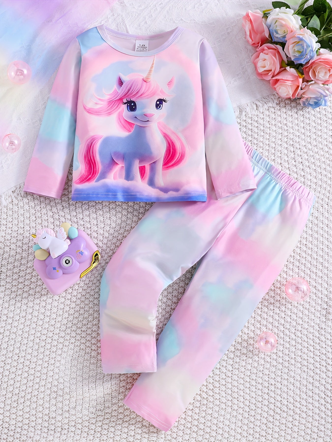 3-pack girls' flame resistant pajama sets with long sleeve crew neck featuring cartoon patterns. Designs include princess, unicorn, and donut cat. Made of polyester spandex for comfortable