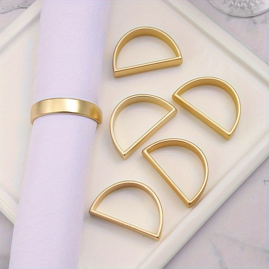 6 golden stainless steel napkin rings for elegant table decor during Christmas and special occasions.