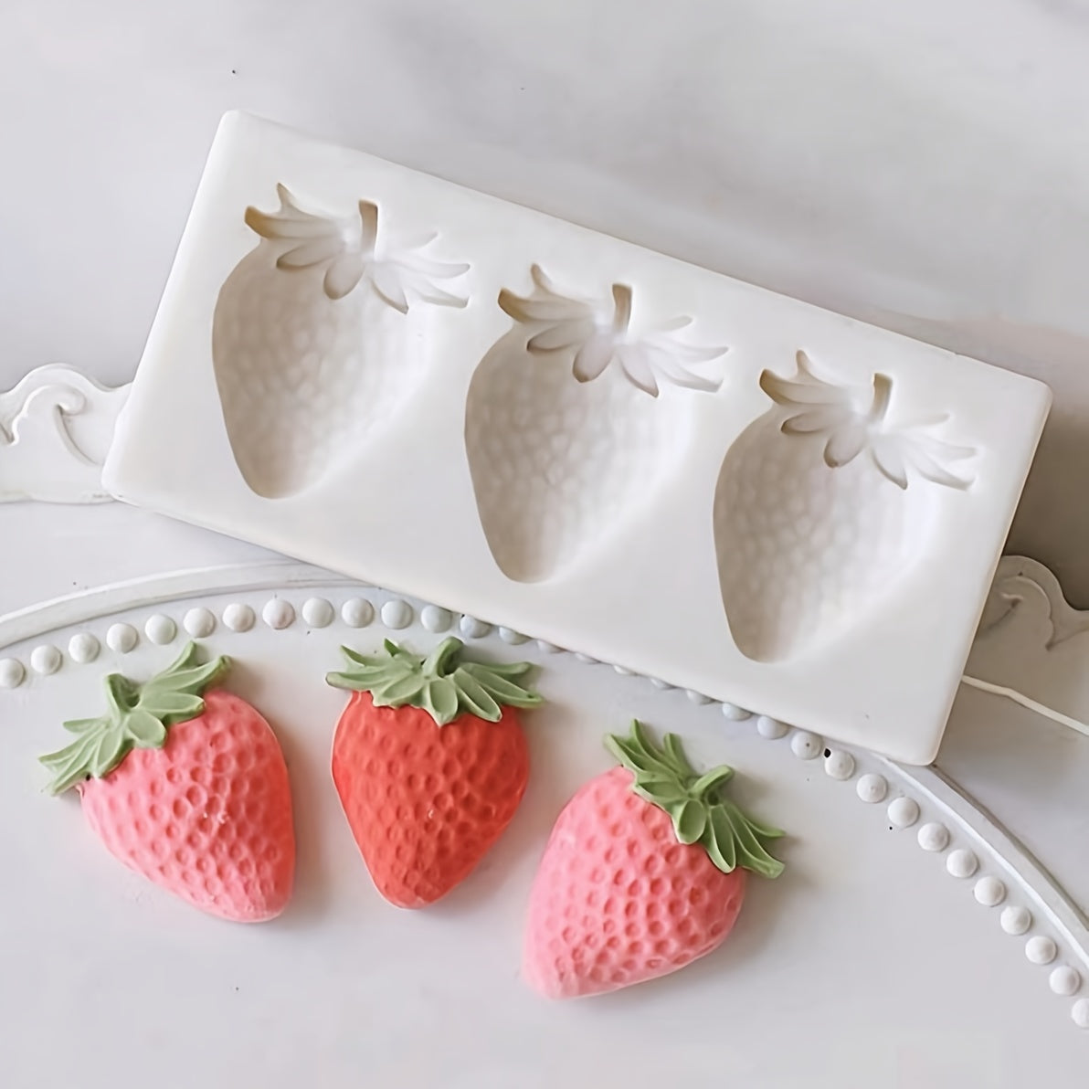 The three consecutive strawberry silicone mold is perfect for making candles, candies, chocolates, resin, clay crafts, ice cream and cake decorations, and many other light uses.