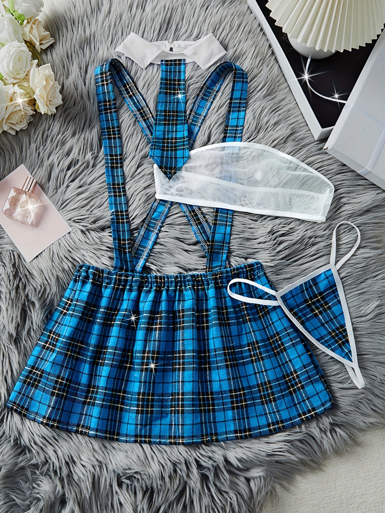 Color block plaid role-playing costume set includes strapless bra, suspender skirt, thong, and tie. Perfect for women's exotic clothing and sexy lingerie.