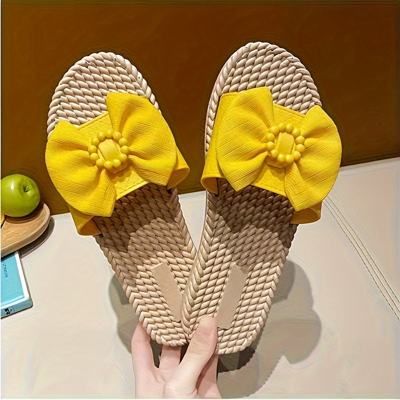 Women's PVC slip-on sandals with bow and bead accents, flat heel, open toe, ideal for beach wear.  Bow embellished, made from synthetic material.