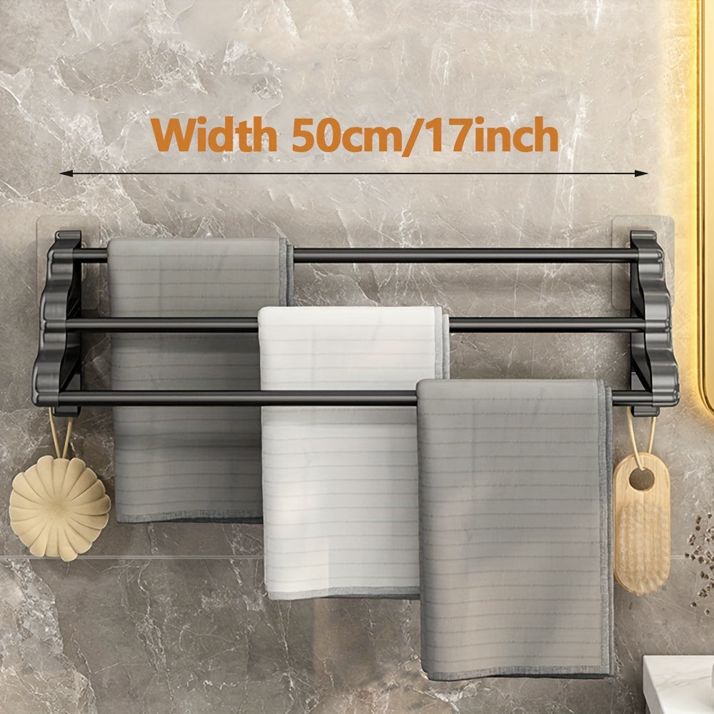 Stylish, durable wall-mounted towel rack with three rods, punch-free installation and easy maintenance, ideal for bathroom storage.