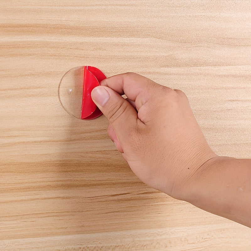 4-Pack of Double-Sided Non-Slip Carpet Stickers for Household Use. These stickers are designed to keep carpets in place without leaving marks on the floor. They are versatile and can be cut into different shapes for various uses.