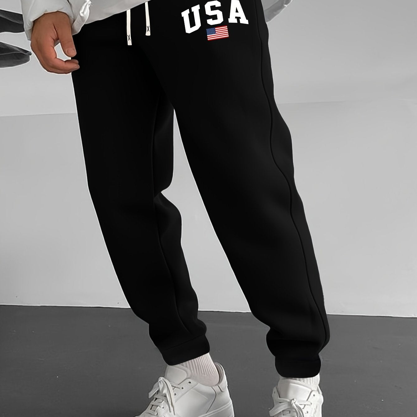 Men's casual knit sweatpants with USA flag print, elastic waist and drawstring for outdoor activities.