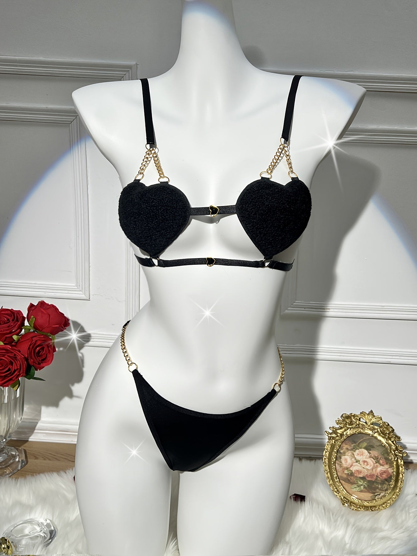 Golden chain lingerie set with heart-shaped double strap bra and thong for women.