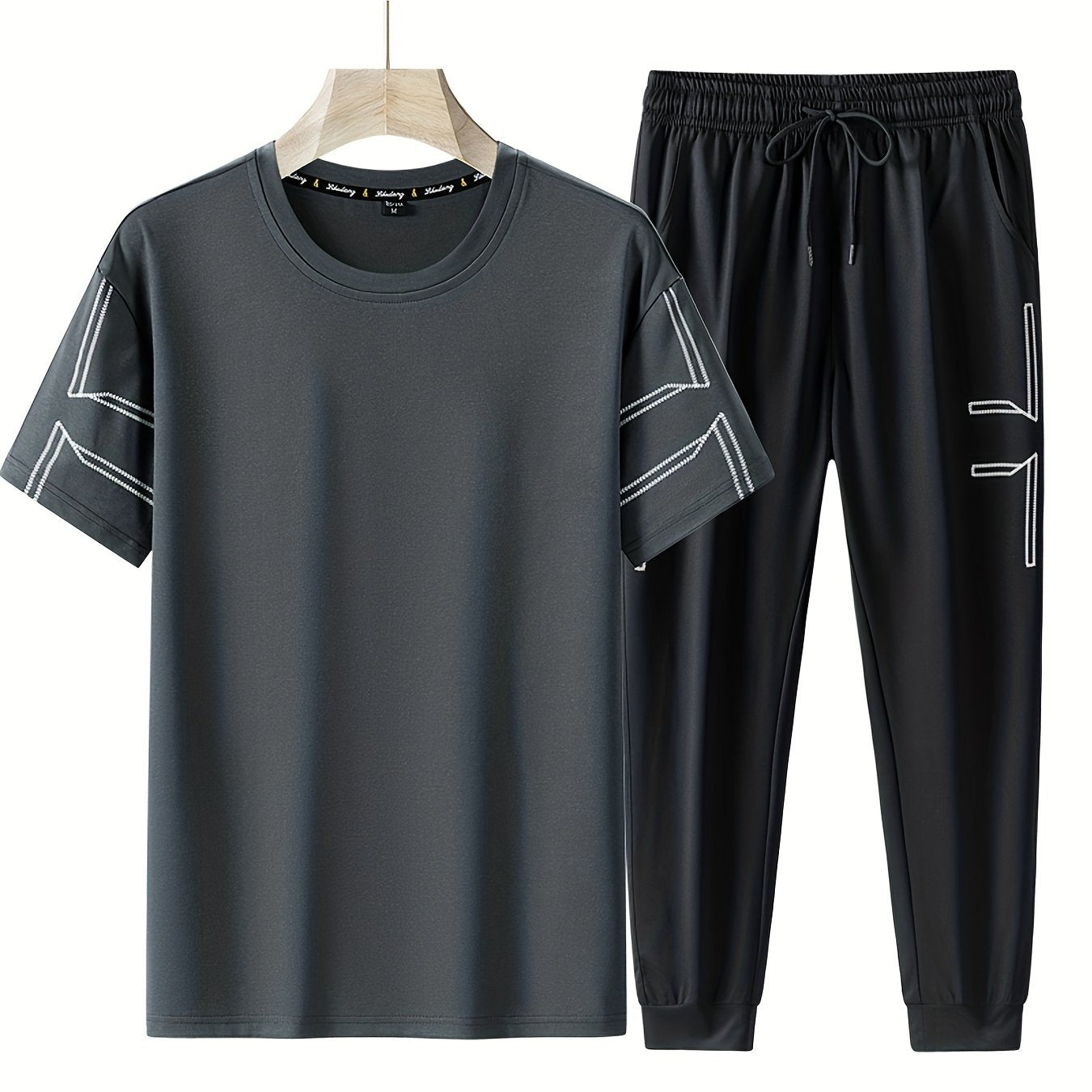 Men's 2 piece outfits with geometric line pattern t-shirt and drawstring jogger pants.