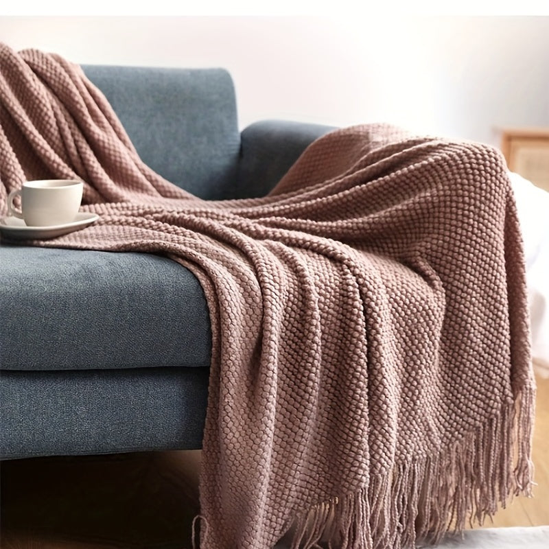 Stay cozy and stylish with this elegant knit throw blanket, featuring tassels for added flair. Made of lightweight acrylic with a bubble textured design, this blanket offers all-season comfort. Perfect for use on the couch, bed, or as home decor, as well