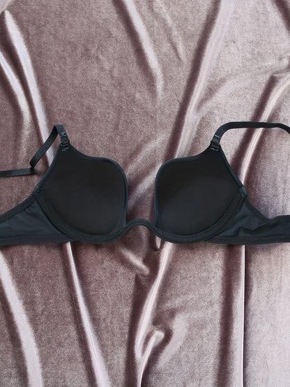 Sleek black push-up bra with deep V neck, thick cushioned support, non-removable pads, nylon & spandex blend, hand washable. Perfect for a chic, supportive, and shapely look. Includes