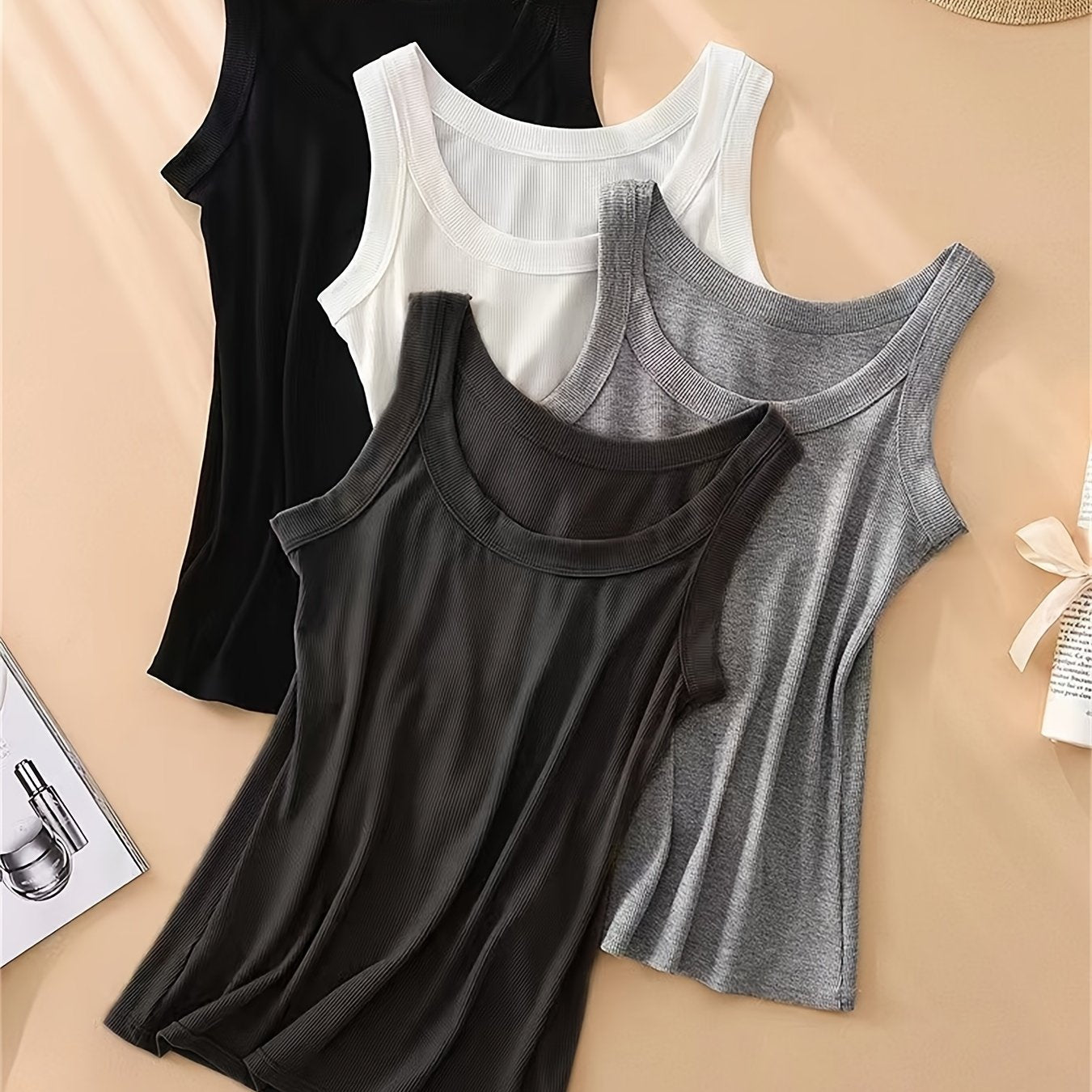 Set of 4 U-neck camisole vests for women, perfect for spring/summer. Can be worn as an outer layer or as a sleeveless base shirt. Features low neckline for breathability and comfort.