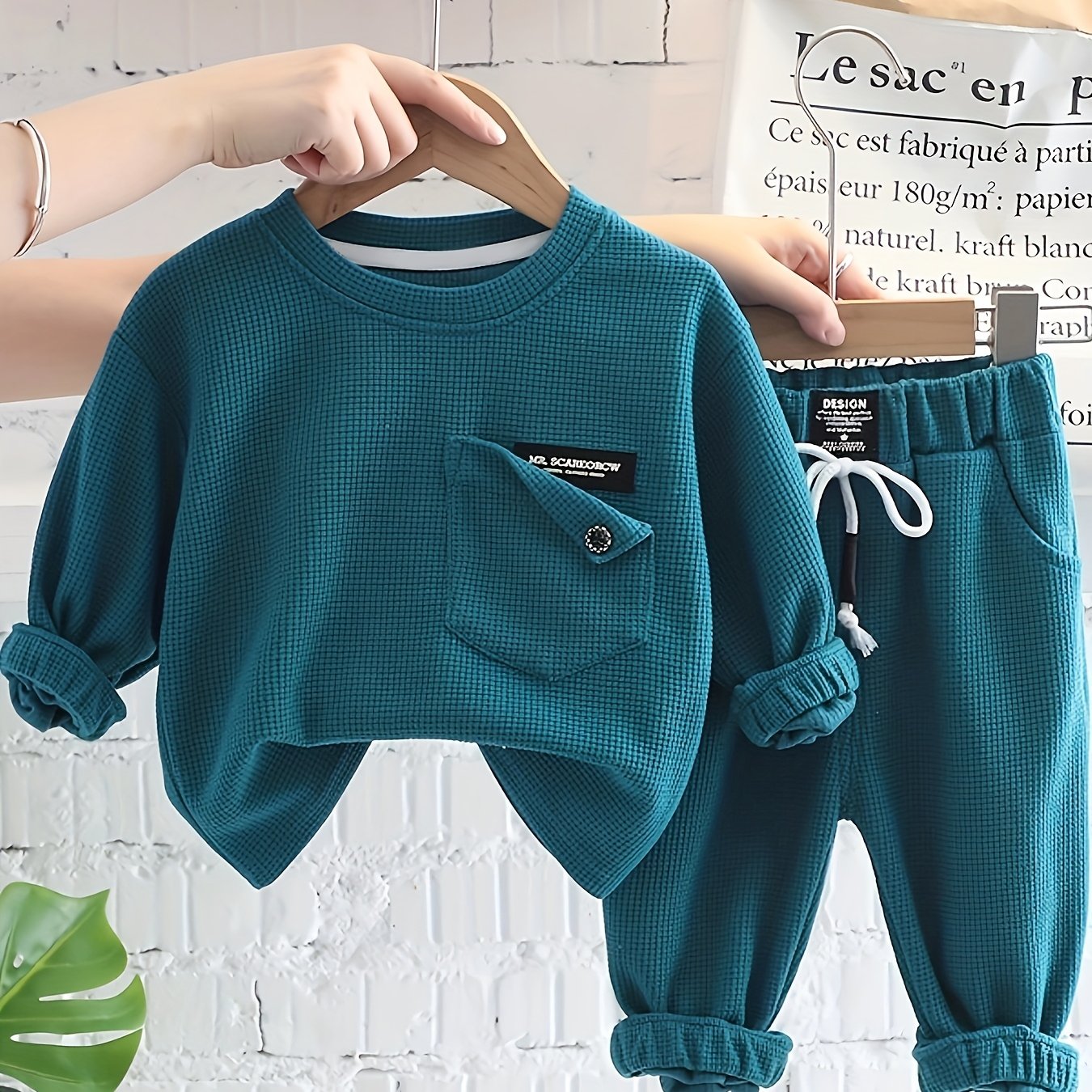 2-piece baby boy's street style set includes waffle textured long sleeve top and sporty casual pants for spring and fall outdoor wear.