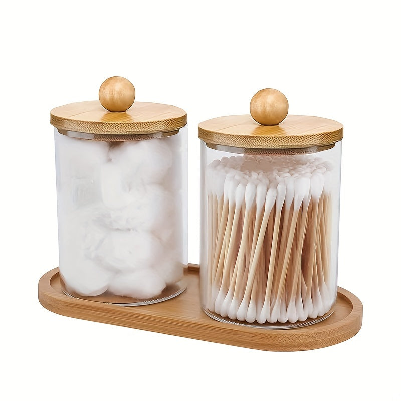 Holder dispenser set with bamboo lids and tray for bathroom storage including cotton swab, ball, pads, and floss.