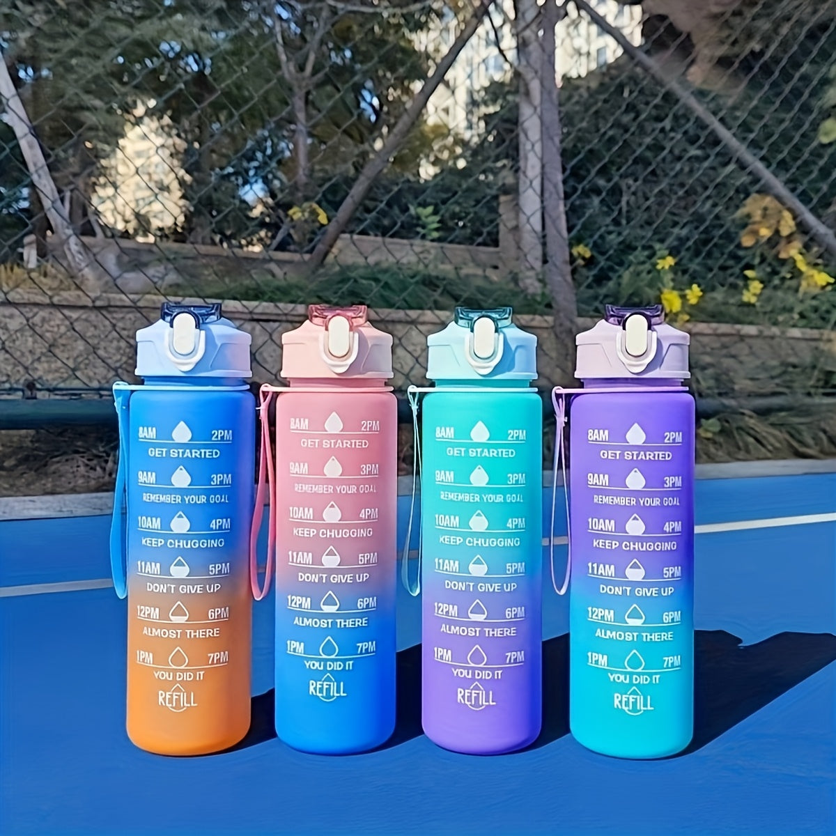 Motivational gradient water bottle with straw, time marker, and carrying strap - BPA-free, leakproof sports cup for fitness activities.