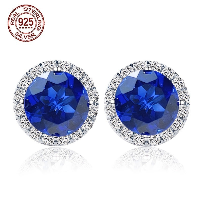 A beautiful pair of royal blue Tanzanite stud earrings in an elegant vintage style. Made from 925 sterling silver and featuring synthetic stones, these earrings are hypoallergenic and perfect for special occasions like weddings, gifting, Valentine's Day