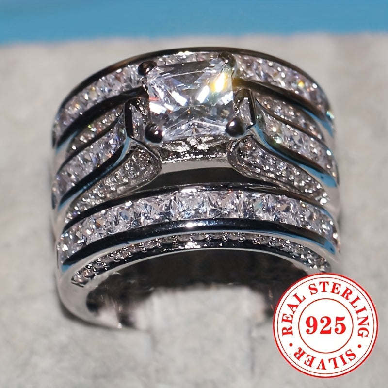 A set of three elegant wedding bands made with luxurious 925 sterling silver, featuring princess cut synthetic cubic zirconia stones in a 4-prong setting. Perfect for April birthdays or as a Valentine's Day gift, this stunning ring set is ideal for both