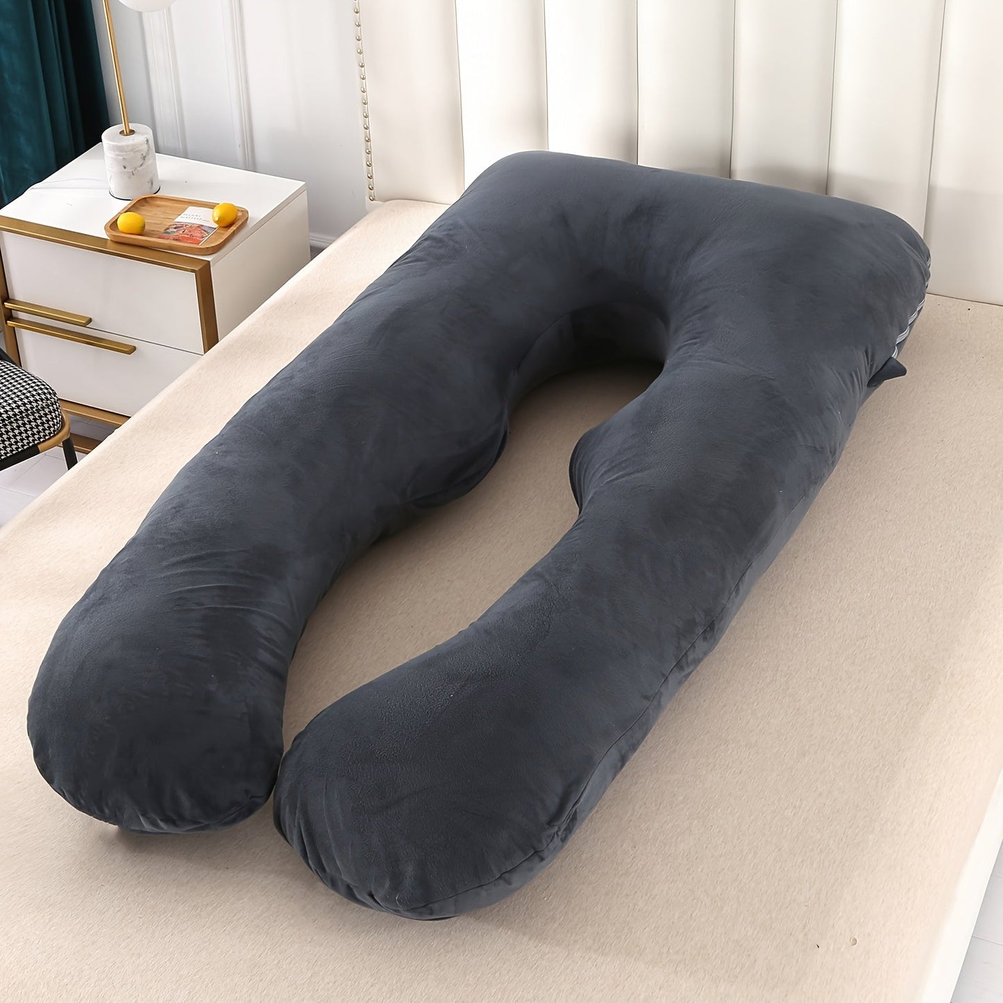 The Extra Comfort U-Shaped Maternity Pillow is a versatile cushion measuring 114.3cm x 53.34cm. Made with soft plush polyester, this pillow provides side sleeper support and is designed to offer relief from abdominal and back pressure during pregnancy.