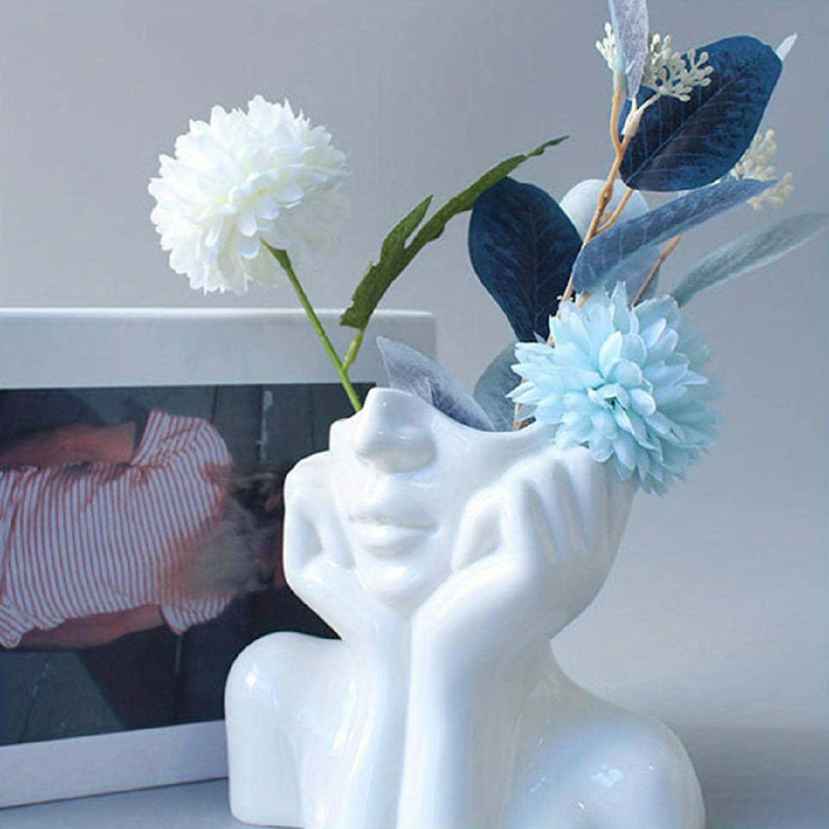 Resin vase with human face design, Nordic home decor, white double-handled vase for tabletop floral display.