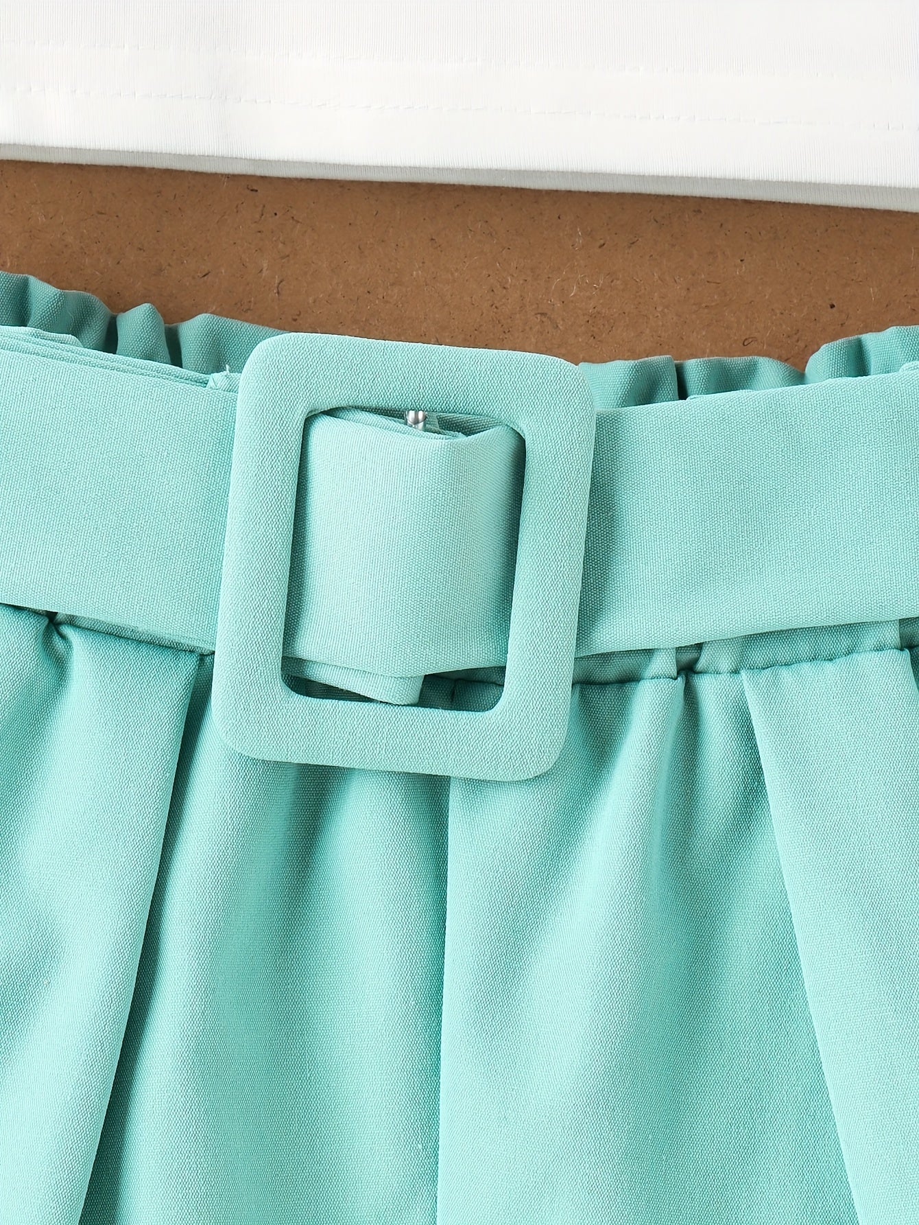 Girls' sleeveless top with flutter trim and elastic waist shorts set for summer party.