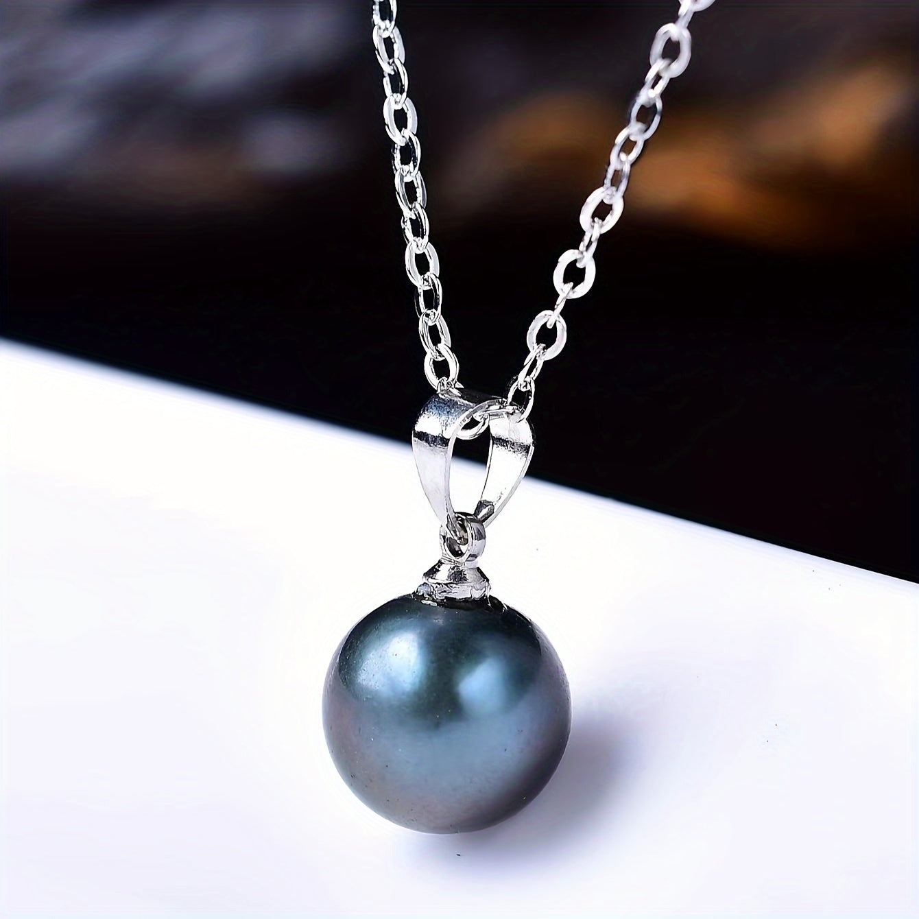 A stunning black pearl pendant necklace in elegant Bohemian style, crafted from S925 Sterling Silver and featuring a lustrous freshwater pearl. Perfect for everyday wear or as a thoughtful gift for a special woman.