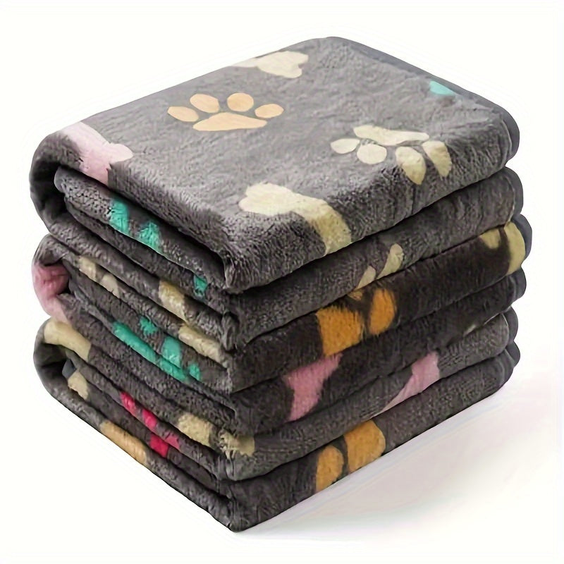 Soft and stain-resistant fleece pet blanket with bone pattern for all sizes of dogs and cats.