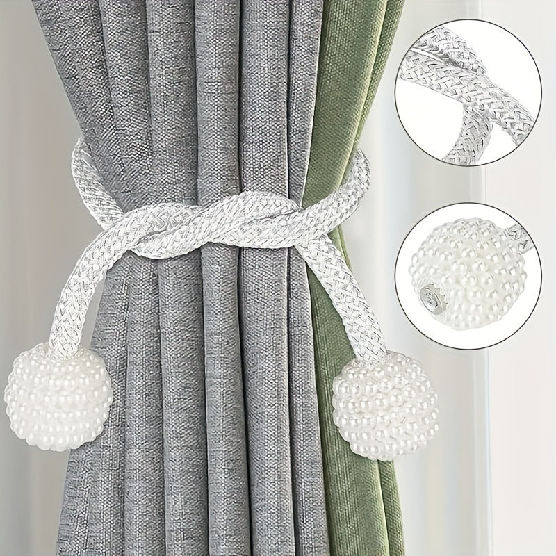 Two pieces of modern style polyester curtain tie backs with a silvery finish. These window drapery holdbacks are perfect for adding a touch of elegance to your home or office decor.