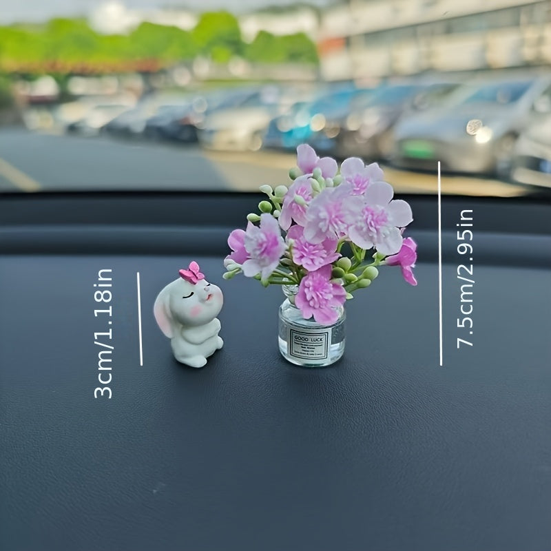 Miniature resin vase for car dashboard décor with healing figurine.