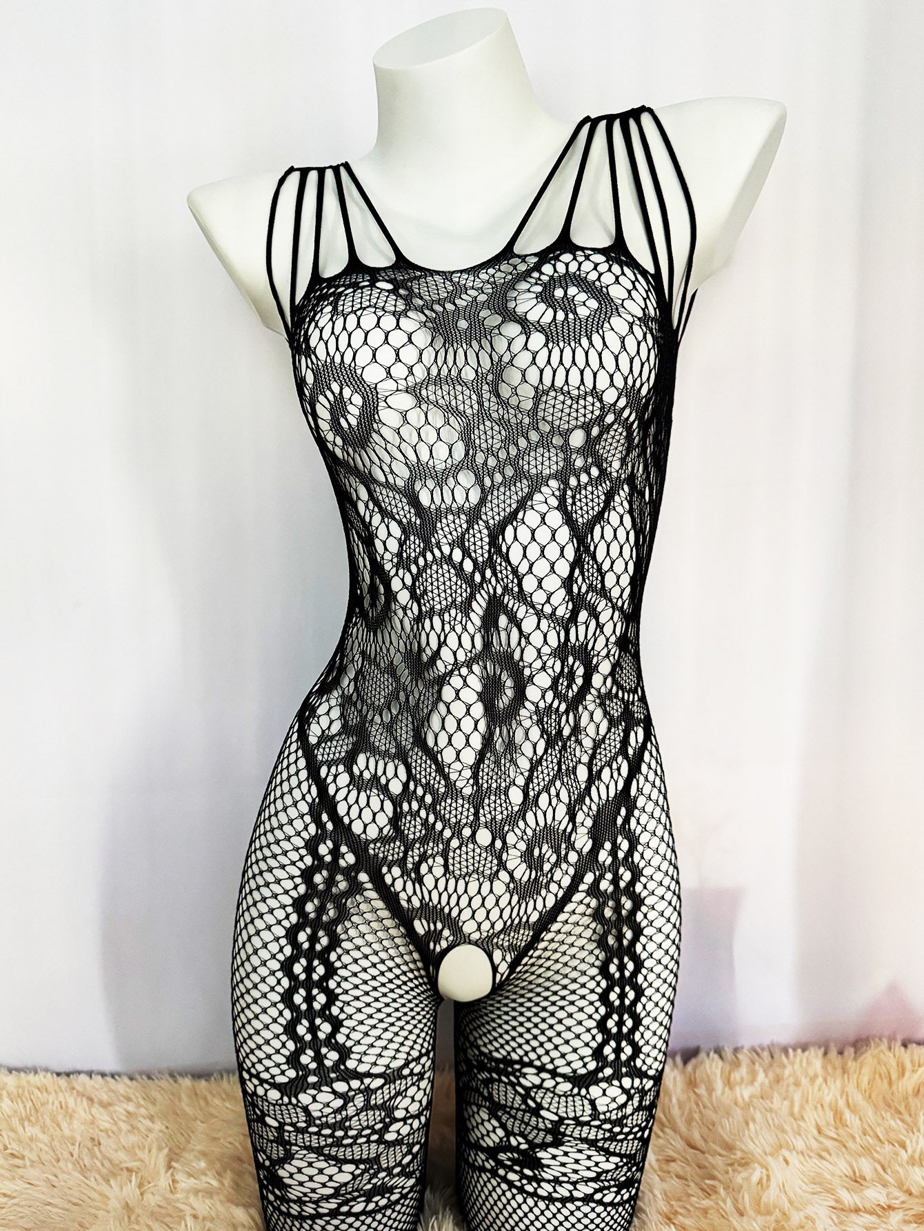 Seductive fishnet bodysuit with jacquard sleeves, crotchless design, and garter socks. Perfect Valentine's Day gift with high quality, comfortable, and stretchy fabric that fits just right.