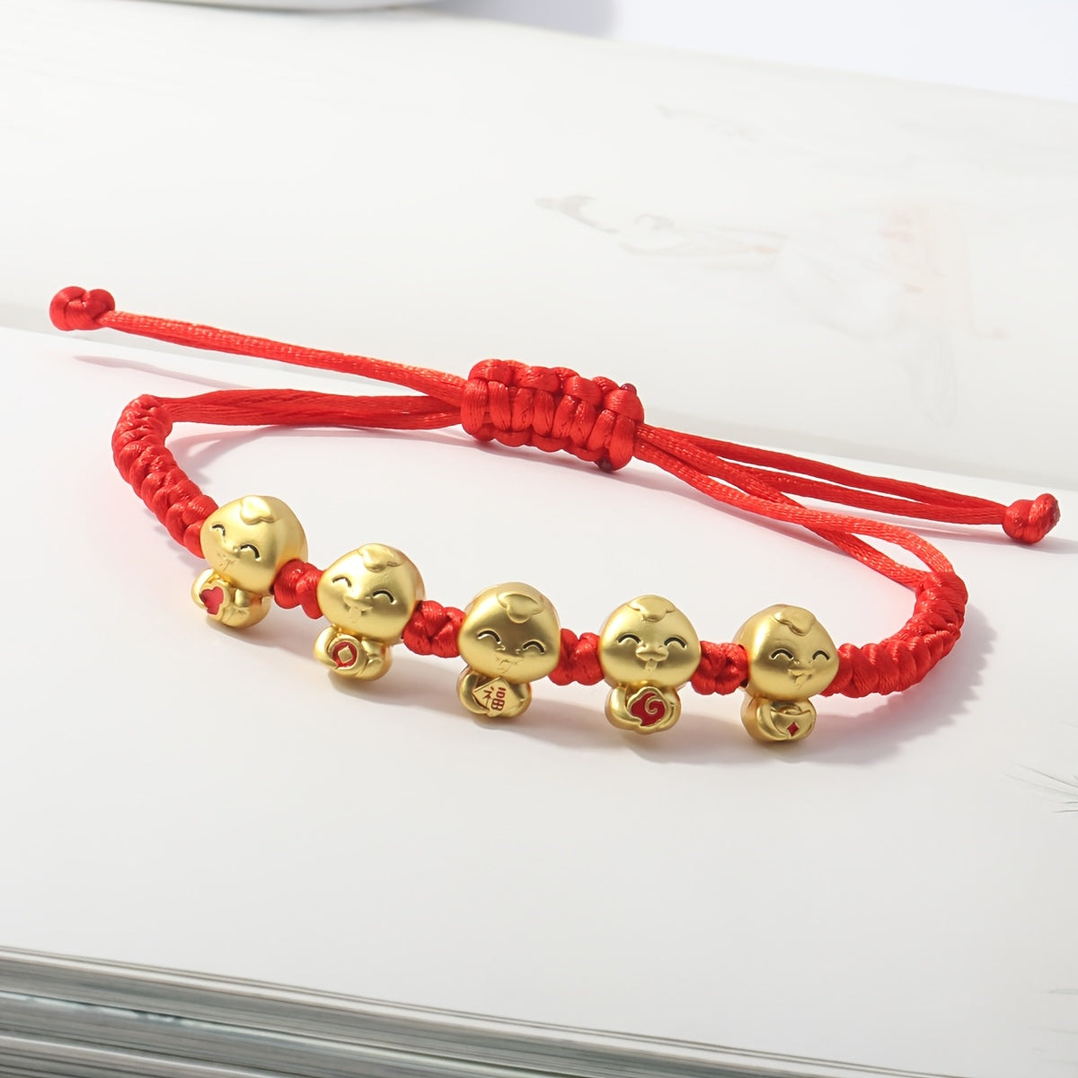 Incorporating a Chinese style and adorned with red thread jewelry, the 2025 Lucky Snake Symbol Red Thread Woven Bracelet showcases five snake pendants, creating a one-of-a-kind piece. Perfect for gifts on birthdays, Valentine's Day, Mother's Day, or as a