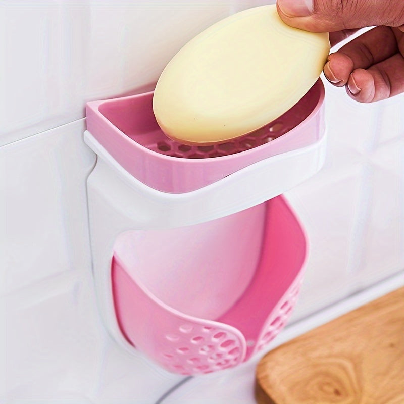 Wall-mounted soap dish with strong adhesive and double-layer design. No-drill drainage system for bathroom and kitchen storage. Features a creative suction cup and soap box.