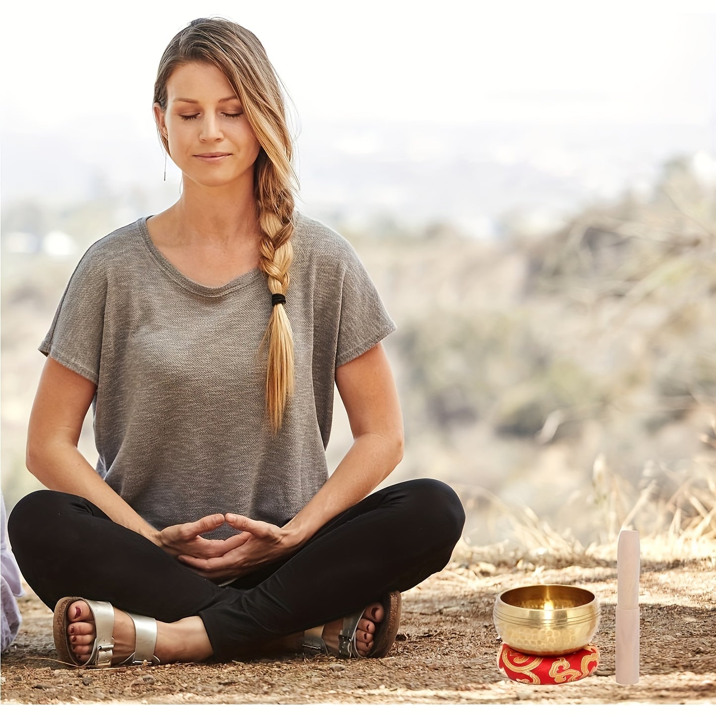 Golden copper Tibetan singing bowl set for relaxation and mindfulness meditation, includes wooden striker. Ideal for yoga, reiki, and travel, portable for office, retreats, and meditation.