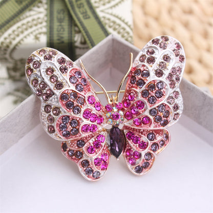 Stylish Rhinestone Butterfly Brooch Pin designed for Women, featuring a Luxurious and Unique Irregular Shape. This Fashion Accessory is perfect for adding a touch of elegance to any outfit. Ideal for Parties or as a special Gift for Couples, this inlaid