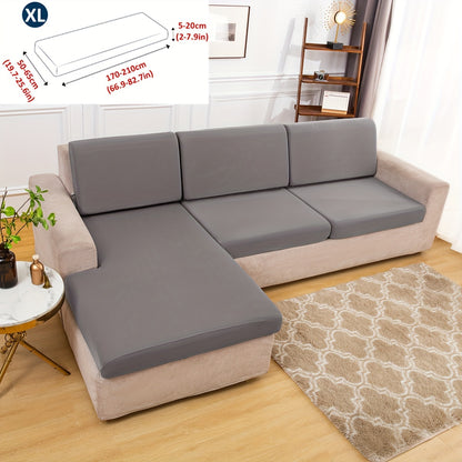 Stretch sofa seat cover to protect living room cushion.