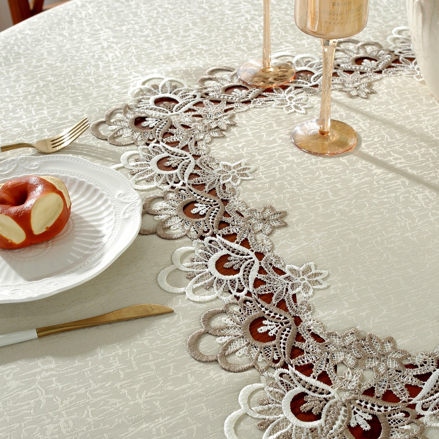 Polyester round tablecloth with lace border, ideal for various occasions in multiple sizes.