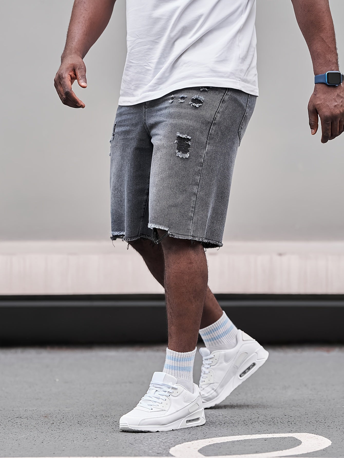 Relaxed fit cotton denim shorts for plus size men with a classic look for casual wear.