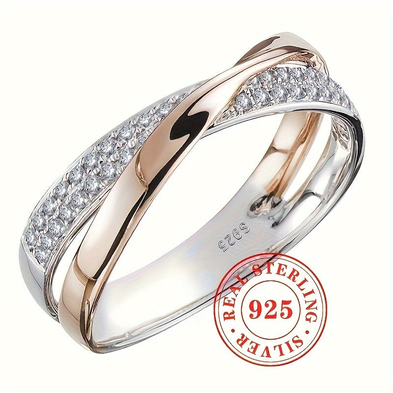 This elegant and simple women's fashion ring is crafted from sterling silver 925, featuring a two-tone Mobius band design adorned with pave cubic zirconia. Perfect for daily wear or special occasions, this stylish piece weighs 0.12oz and adds a touch of