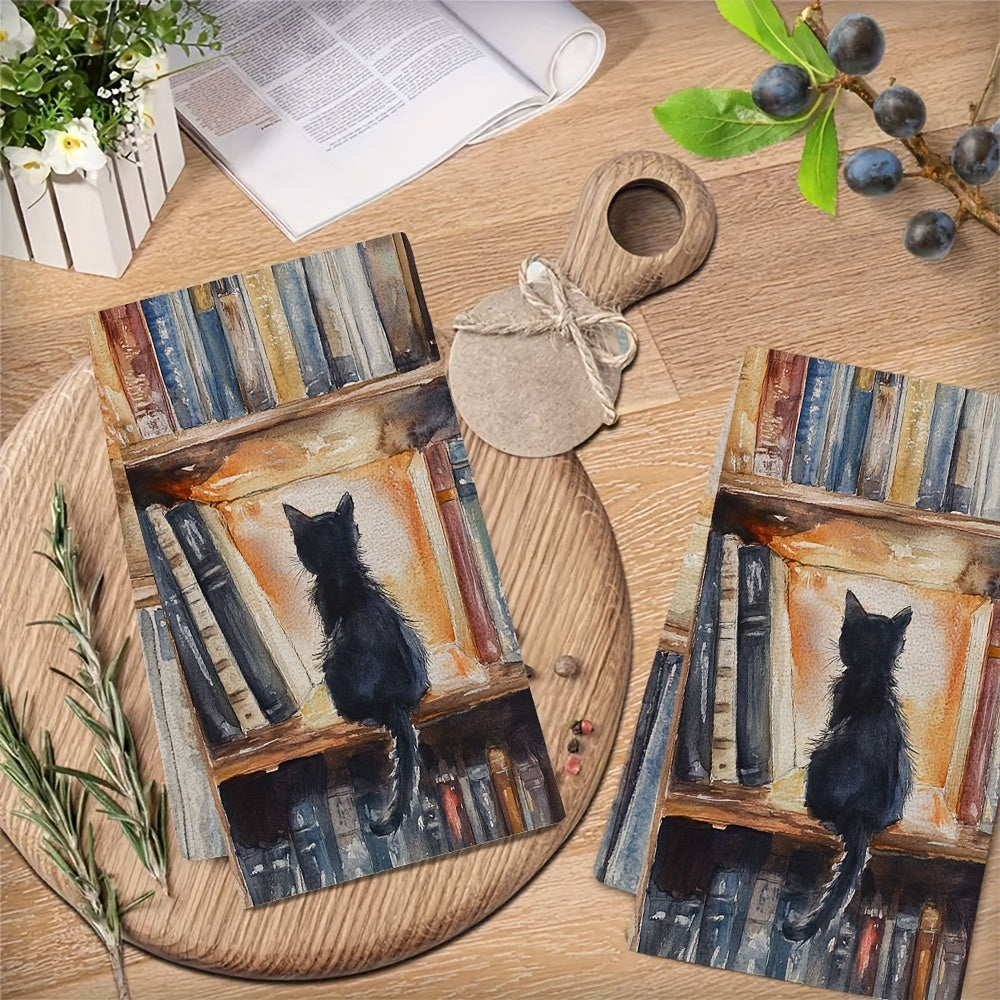 Two pieces of ultra soft kitchen towels featuring a charming library kitten design. These highly absorbent and machine washable dish hand towels measure a cozy 40.64x60.96 cm, making them perfect for home decor and practical for kitchen use.