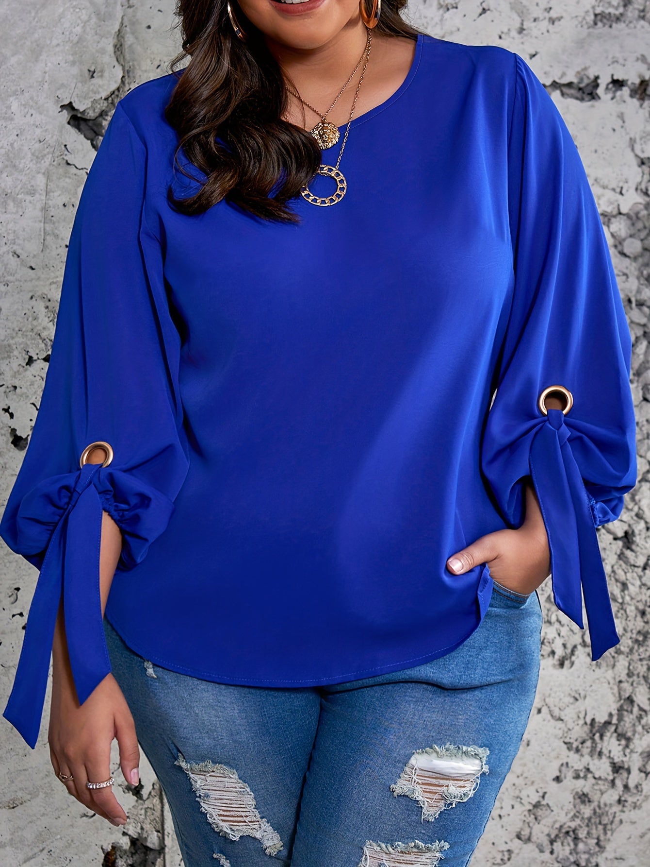 Elegant plus size royal blue satin blouse with tie sleeves, round neck, and smooth texture. Perfect for spring, summer, and fall.