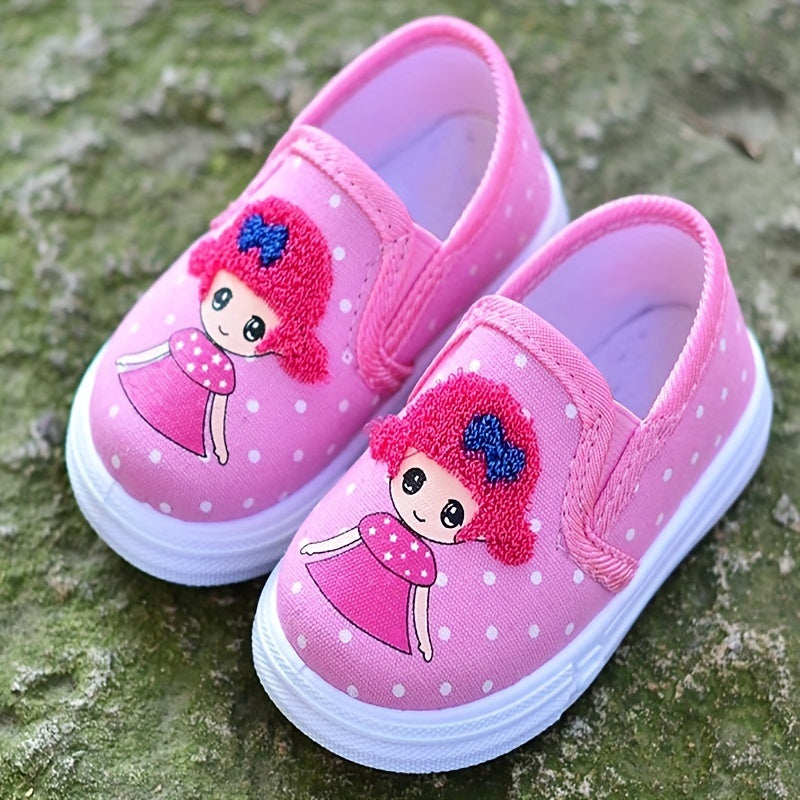 Adorable pink polka dot slip-on canvas shoes for girls featuring cute cartoon embroidery, breathable fabric, lightweight and comfortable for spring and fall. Durable TPR sole and easy