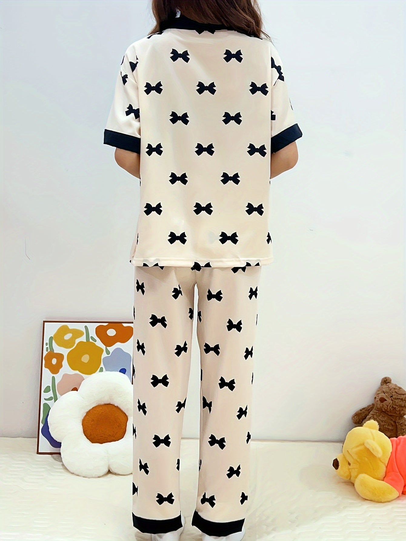 Summery short-sleeved women's pajama suit with sweet V-neck cardigan and thin material perfect for summer.